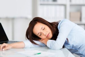 woman asleep on desk