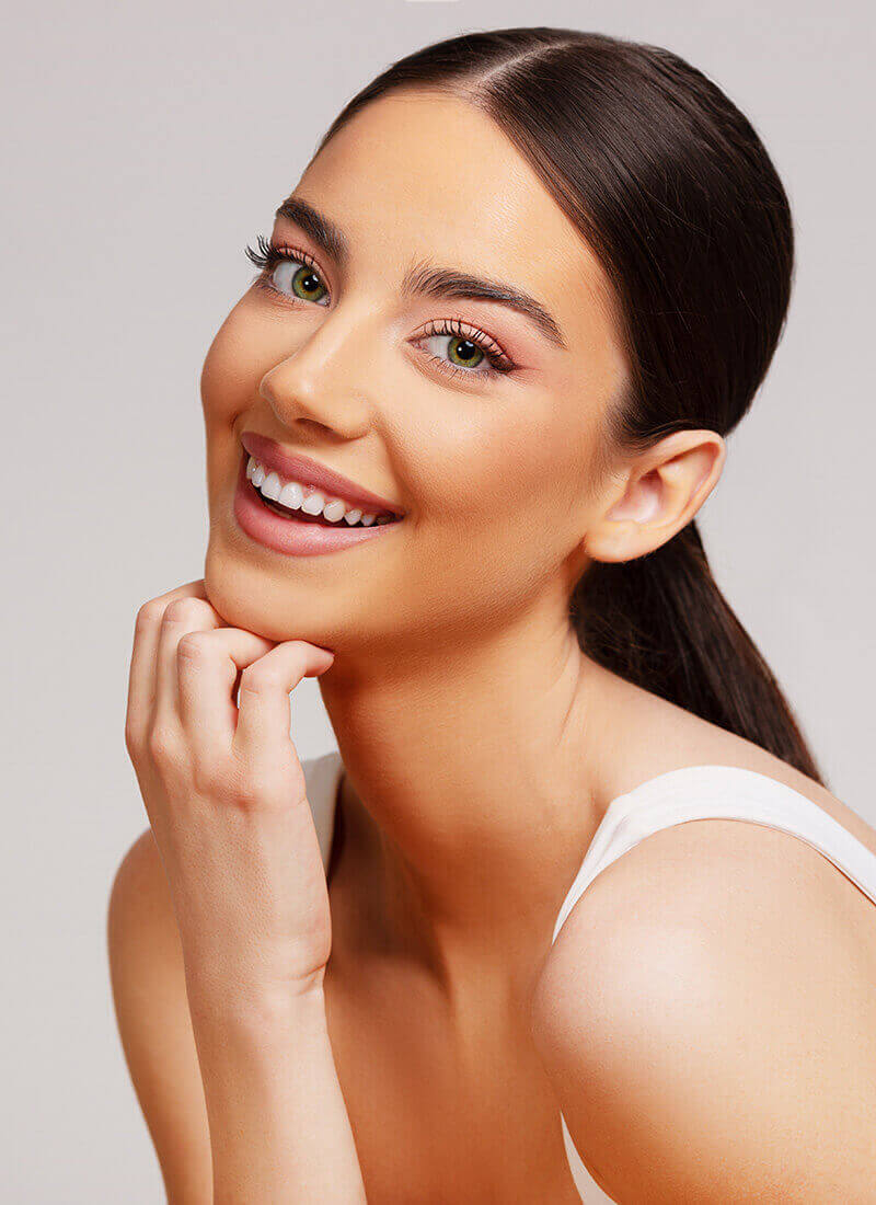 Young woman touching her chin