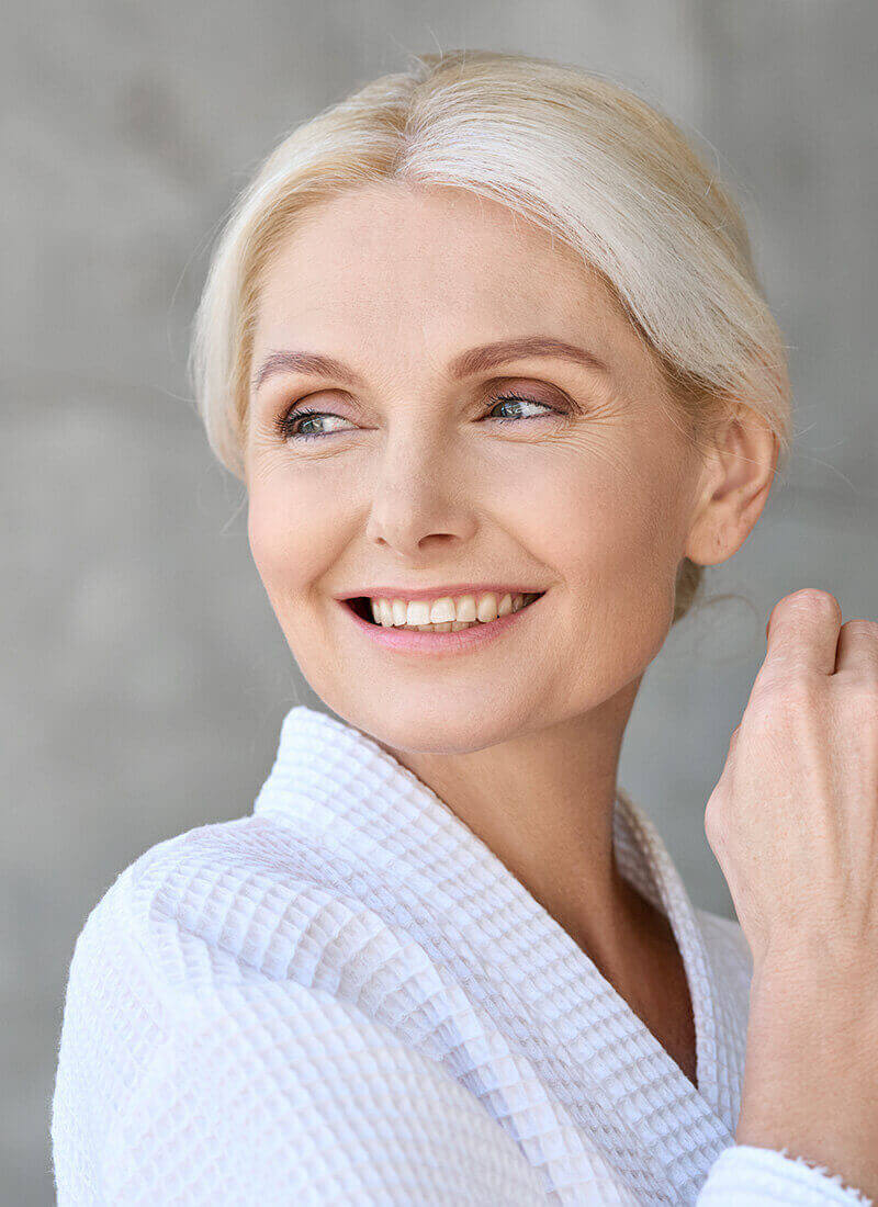 Mature woman in a white robe